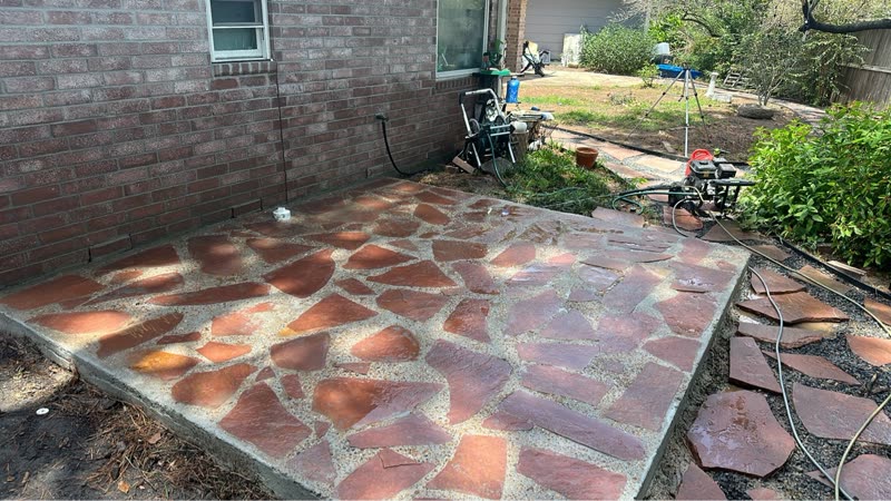 Freshly washed flagstone patio with equipment